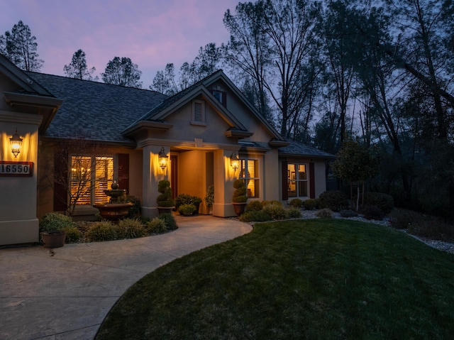 view of front of property with a yard