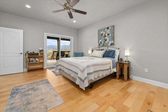 bedroom with ceiling fan, hardwood / wood-style floors, and access to outside