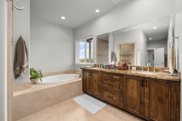 bathroom featuring vanity, tile patterned floors, and plus walk in shower