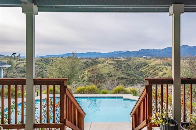 view of pool with a mountain view