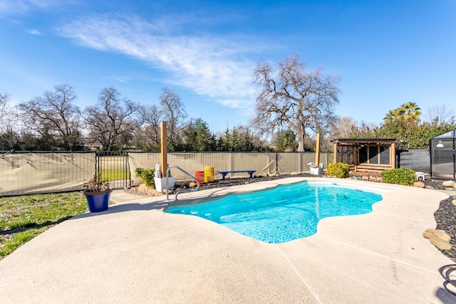 view of pool featuring an outdoor structure and a patio area