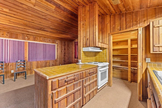 kitchen with light carpet, tile countertops, and white range with electric cooktop