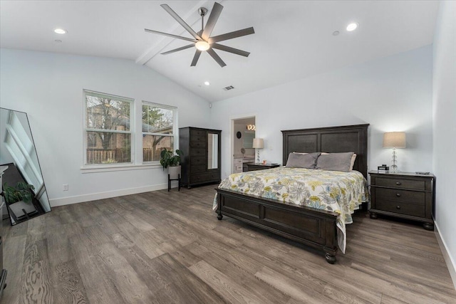 bedroom with ceiling fan, lofted ceiling with beams, and hardwood / wood-style floors