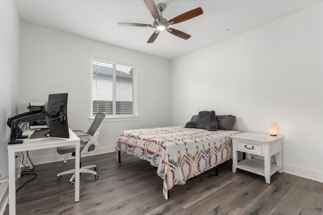 bedroom with dark wood-type flooring and ceiling fan