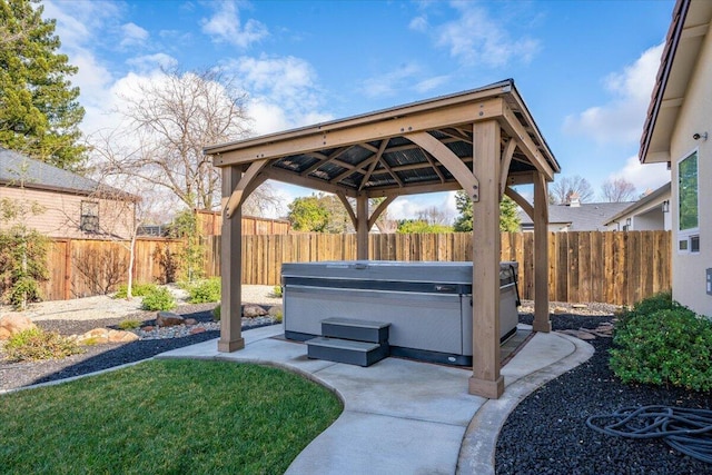 view of patio / terrace featuring a gazebo and a hot tub