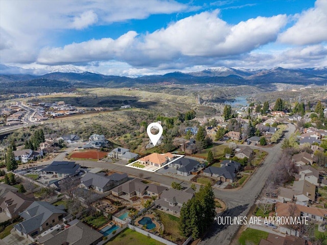 birds eye view of property featuring a mountain view