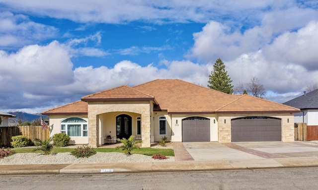 3720 Sunflower Dr, Redding, CA 96001 - mediterranean / spanish house with an attached garage, driveway, fence, and stucco siding