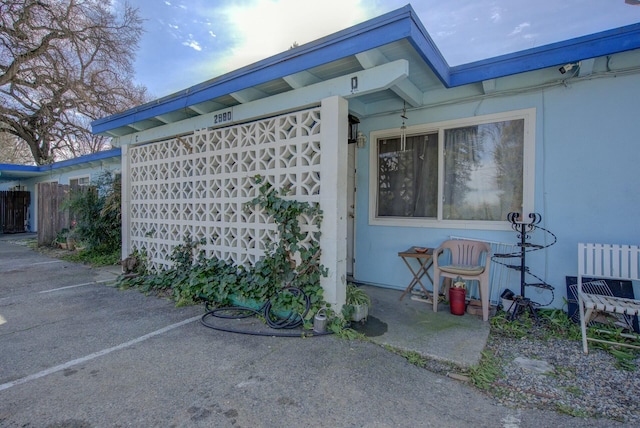 view of property exterior featuring a patio area