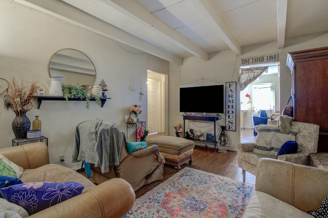 living room featuring beam ceiling and hardwood / wood-style flooring