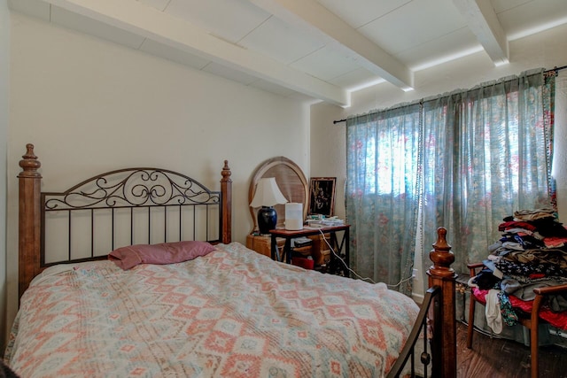 bedroom featuring beam ceiling