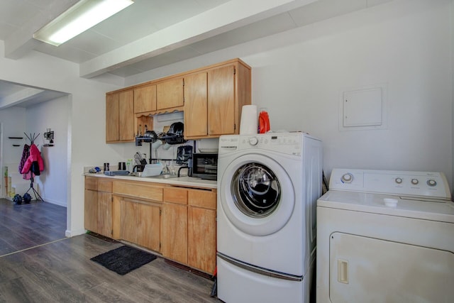 washroom with separate washer and dryer and dark hardwood / wood-style floors