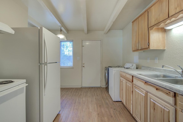 kitchen featuring beamed ceiling, washer / dryer, sink, and light brown cabinets