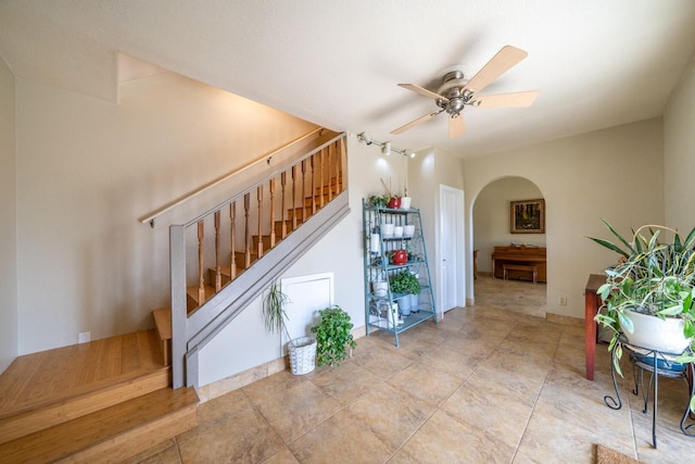 stairway with ceiling fan