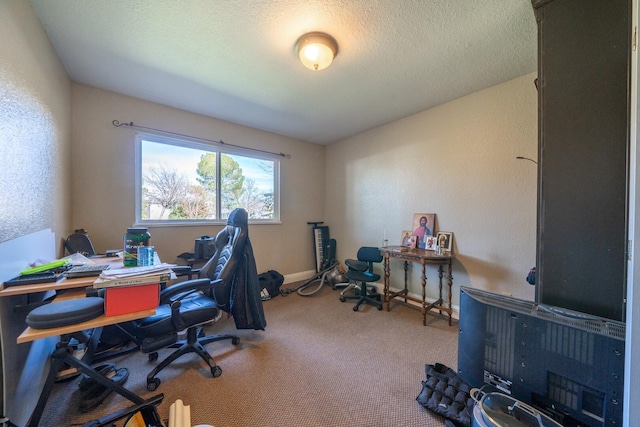 carpeted home office with a textured ceiling