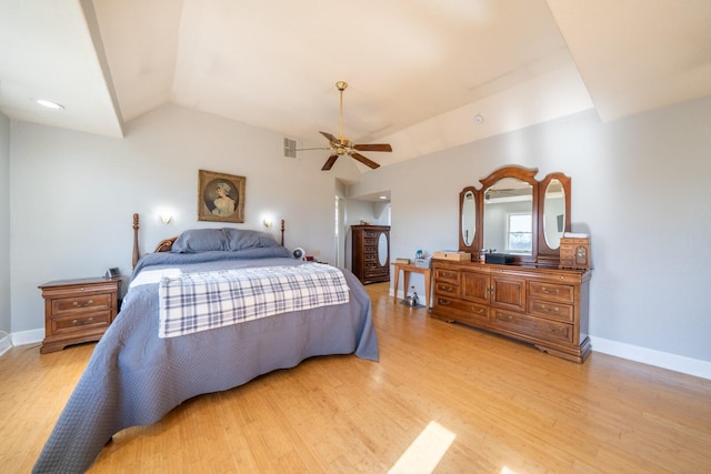 bedroom with light hardwood / wood-style flooring, ceiling fan, and vaulted ceiling