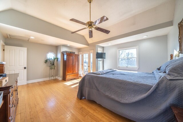 bedroom featuring ceiling fan, vaulted ceiling, and light hardwood / wood-style flooring