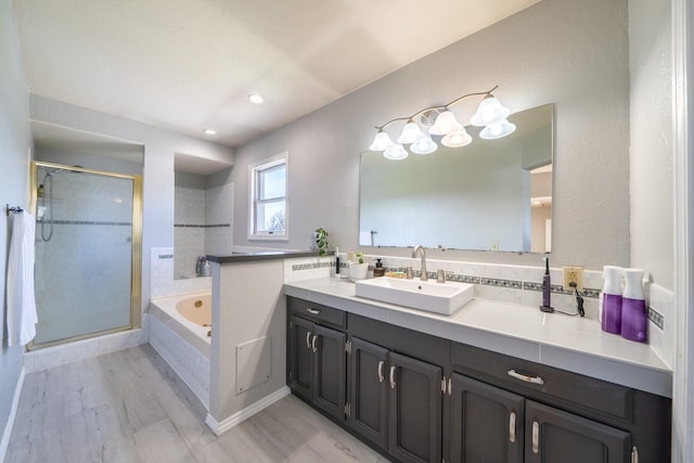 bathroom featuring vanity and separate shower and tub