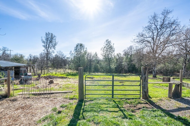 view of gate featuring a rural view