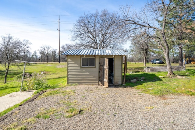 view of outdoor structure with a yard