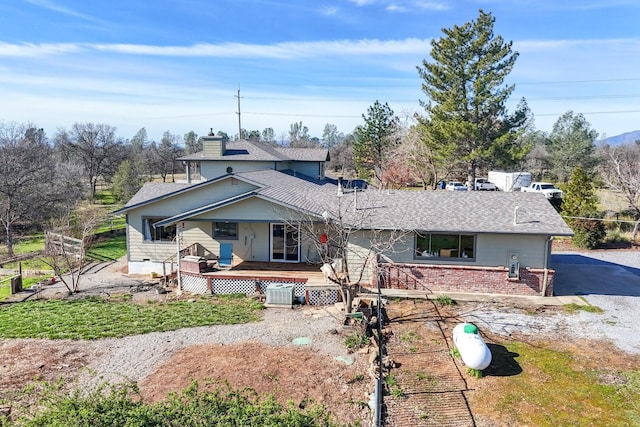 back of property featuring a deck