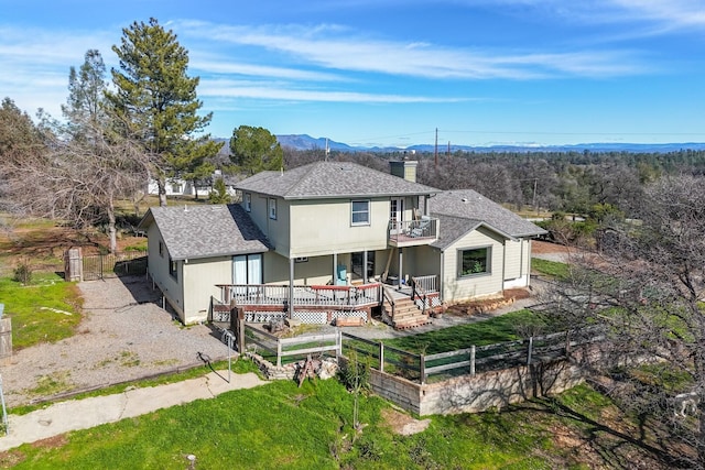 back of house featuring a wooden deck