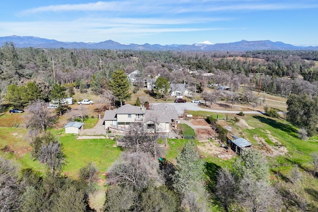 birds eye view of property with a mountain view