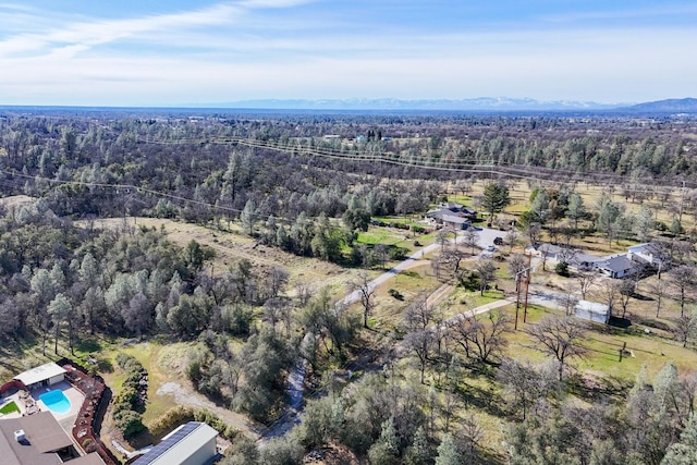 birds eye view of property featuring a mountain view