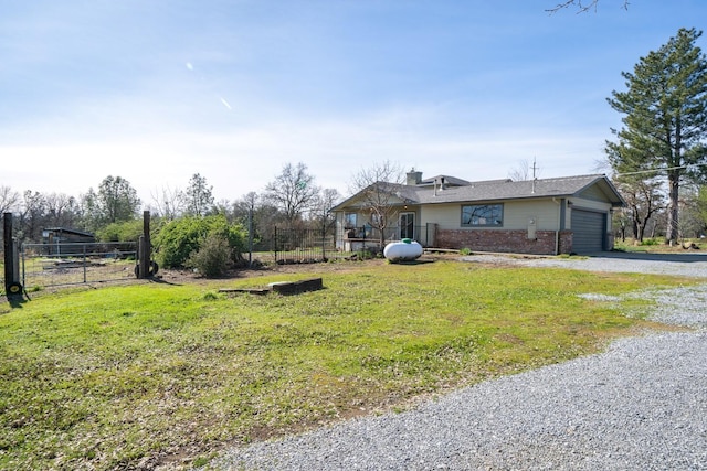 view of front facade featuring a garage and a front lawn