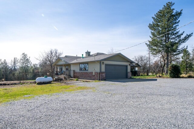 ranch-style house featuring a garage