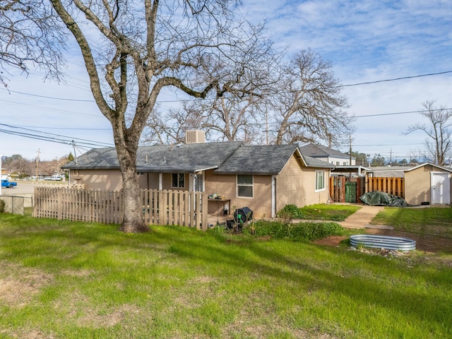 back of property featuring a yard