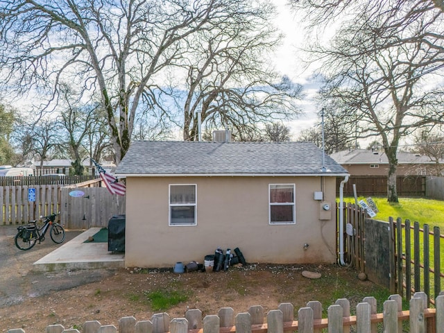 view of side of home featuring a patio