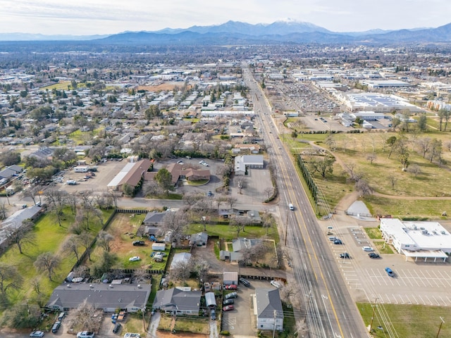 birds eye view of property with a mountain view