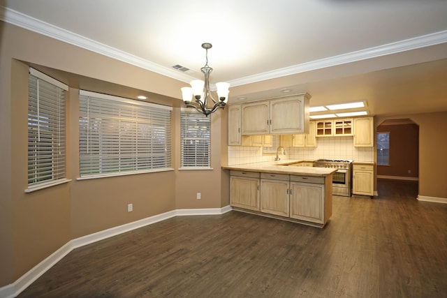 kitchen with light brown cabinetry, high end stainless steel range oven, pendant lighting, dark hardwood / wood-style flooring, and kitchen peninsula