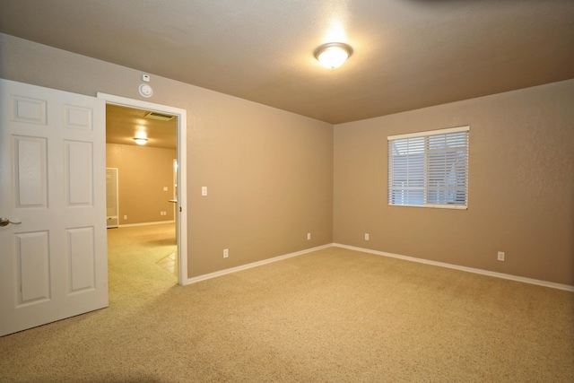 spare room with carpet floors