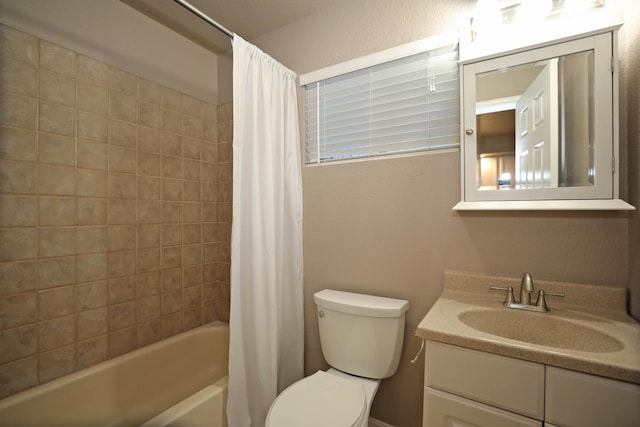 full bathroom with vanity, toilet, and shower / bath combo with shower curtain