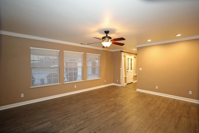 empty room with ceiling fan, dark hardwood / wood-style floors, and ornamental molding