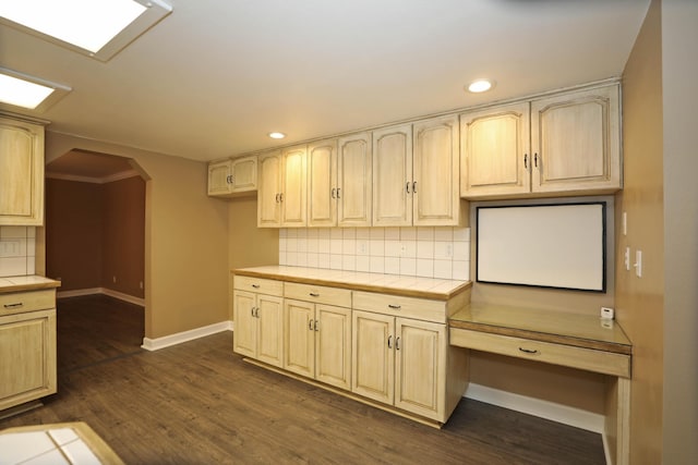 kitchen featuring tile countertops, tasteful backsplash, and dark hardwood / wood-style flooring