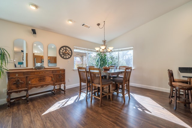 dining space with baseboards, visible vents, vaulted ceiling, and dark wood-style flooring