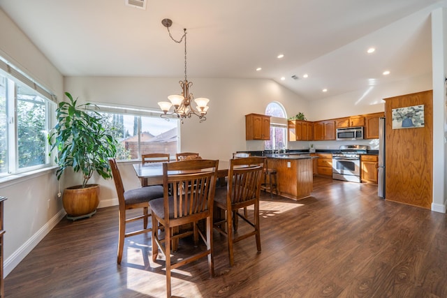 dining space with baseboards, visible vents, dark wood finished floors, an inviting chandelier, and vaulted ceiling