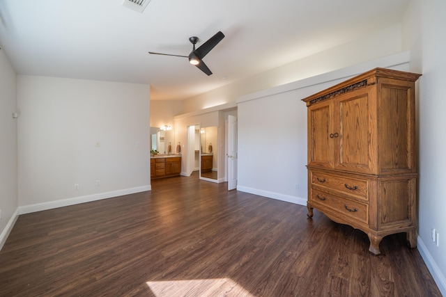 unfurnished bedroom with dark wood-style floors, visible vents, baseboards, and a ceiling fan