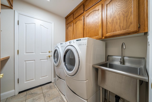 laundry room featuring washer and dryer and cabinet space