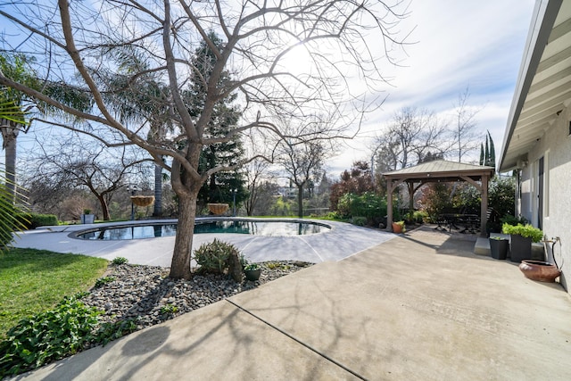 pool with a patio and a gazebo