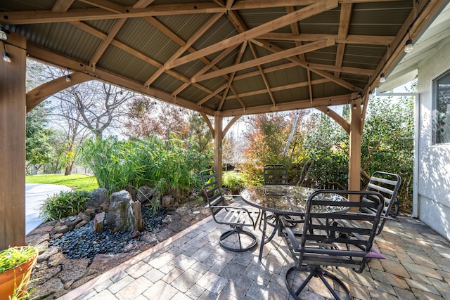 view of patio featuring a gazebo and outdoor dining space