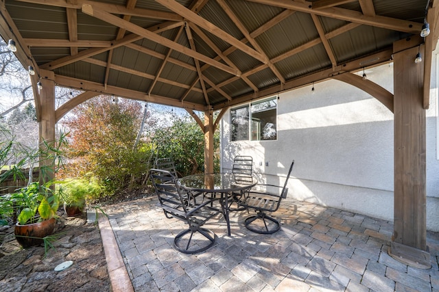 view of patio / terrace with outdoor dining space and a gazebo