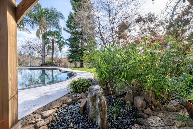 outdoor pool featuring a patio