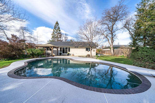 pool featuring a patio and fence