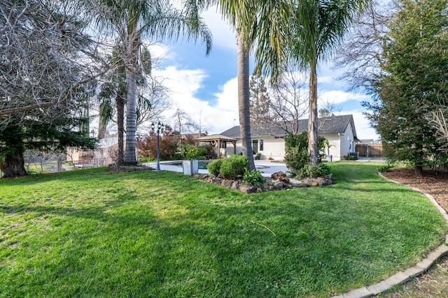 view of yard with a patio, a gazebo, and fence