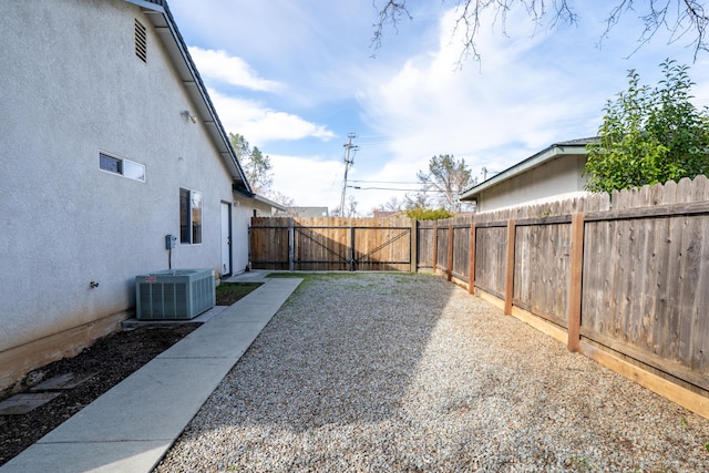 view of yard featuring a fenced backyard and cooling unit