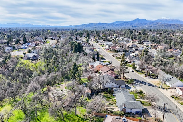 drone / aerial view featuring a residential view and a mountain view