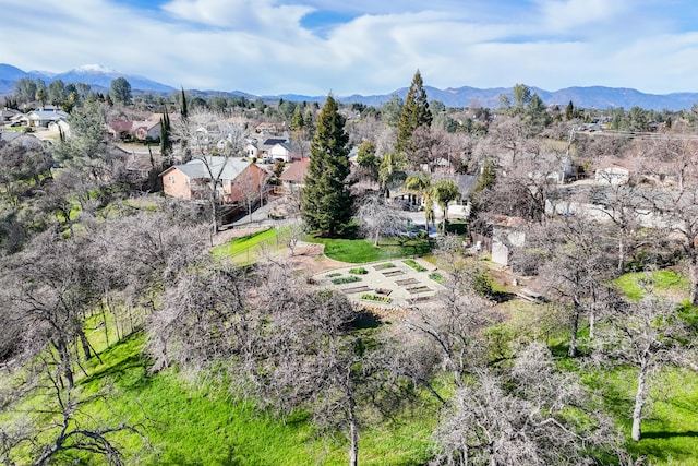 drone / aerial view featuring a residential view and a mountain view